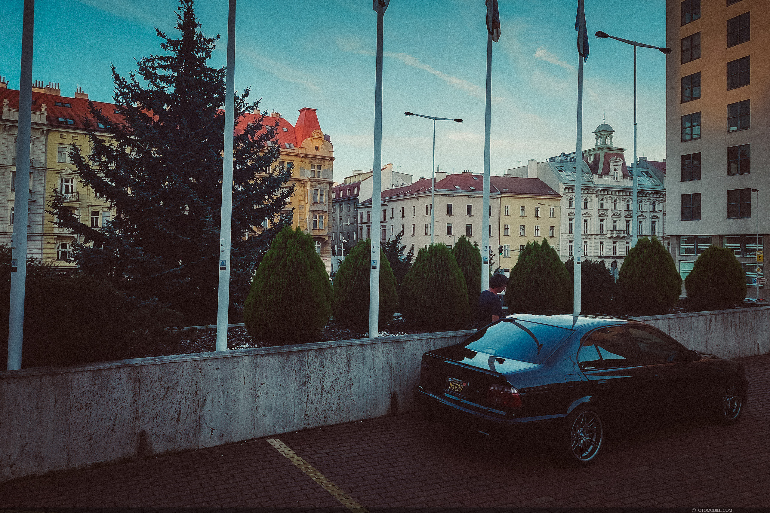 BMW E39 Parked Next to the Construction Site of an Apartment Building ·  Free Stock Photo